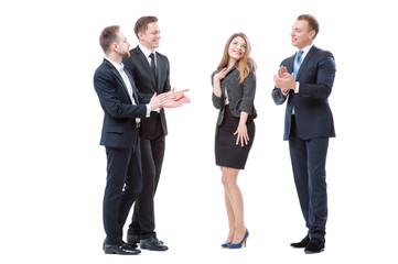 Business woman take up greetings from her male colleagues.