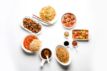 Assorted Indo chinese dishes in group includes Schezwan/Szechuan hakka noodles, veg fried rice, veg manchurian, american chop suey, chilli paneer, crispy vegetable and vegetable soup