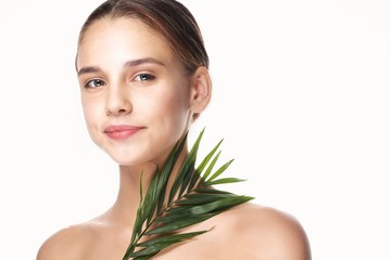 young woman with perfect skin looking at camera