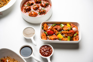 Assorted Indo chinese dishes in group includes Schezwan/Szechuan hakka noodles, veg fried rice, veg manchurian, american chop suey, chilli paneer, crispy vegetable and vegetable soup