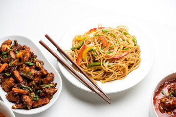 Assorted Indo chinese dishes in group includes Schezwan/Szechuan hakka noodles, veg fried rice, veg manchurian, american chop suey, chilli paneer, crispy vegetable and vegetable soup