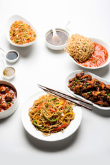 Assorted Indo chinese dishes in group includes Schezwan/Szechuan hakka noodles, veg fried rice, veg manchurian, american chop suey, chilli paneer, crispy vegetable and vegetable soup