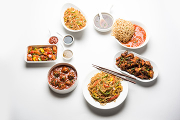 Assorted Indo chinese dishes in group includes Schezwan/Szechuan hakka noodles, veg fried rice, veg manchurian, american chop suey, chilli paneer, crispy vegetable and vegetable soup