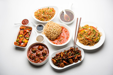 Assorted Indo chinese dishes in group includes Schezwan/Szechuan hakka noodles, veg fried rice, veg manchurian, american chop suey, chilli paneer, crispy vegetable and vegetable soup