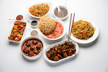 Assorted Indo chinese dishes in group includes Schezwan/Szechuan hakka noodles, veg fried rice, veg manchurian, american chop suey, chilli paneer, crispy vegetable and vegetable soup