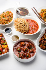 Assorted Indo chinese dishes in group includes Schezwan/Szechuan hakka noodles, veg fried rice, veg manchurian, american chop suey, chilli paneer, crispy vegetable and vegetable soup