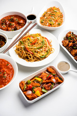 Assorted Indo chinese dishes in group includes Schezwan/Szechuan hakka noodles, veg fried rice, veg manchurian, american chop suey, chilli paneer, crispy vegetable and vegetable soup