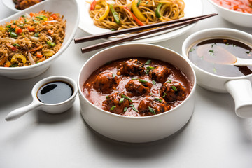 Assorted Indo chinese dishes in group includes Schezwan/Szechuan hakka noodles, veg fried rice, veg manchurian, american chop suey, chilli paneer, crispy vegetable and vegetable soup