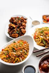Assorted Indo chinese dishes in group includes Schezwan/Szechuan hakka noodles, veg fried rice, veg manchurian, american chop suey, chilli paneer, crispy vegetable and vegetable soup