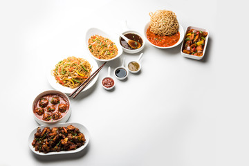 Assorted Indo chinese dishes in group includes Schezwan/Szechuan hakka noodles, veg fried rice, veg manchurian, american chop suey, chilli paneer, crispy vegetable and vegetable soup