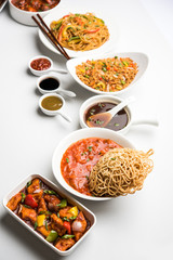 Assorted Indo chinese dishes in group includes Schezwan/Szechuan hakka noodles, veg fried rice, veg manchurian, american chop suey, chilli paneer, crispy vegetable and vegetable soup