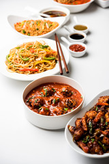 Assorted Indo chinese dishes in group includes Schezwan/Szechuan hakka noodles, veg fried rice, veg manchurian, american chop suey, chilli paneer, crispy vegetable and vegetable soup