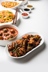 Assorted Indo chinese dishes in group includes Schezwan/Szechuan hakka noodles, veg fried rice, veg manchurian, american chop suey, chilli paneer, crispy vegetable and vegetable soup