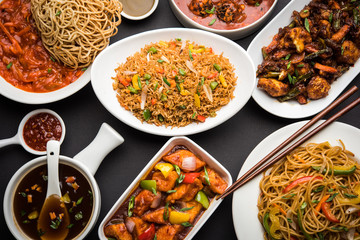 Assorted Indo chinese dishes in group includes Schezwan/Szechuan hakka noodles, veg fried rice, veg...