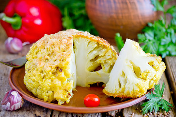 Whole roasted spicy cauliflower with crusty cheese bread crumb crust