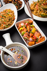 Assorted Indo chinese dishes in group includes Schezwan/Szechuan hakka noodles, veg fried rice, veg manchurian, american chop suey, chilli paneer, crispy vegetable and vegetable soup