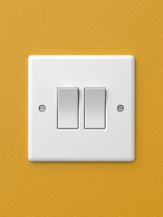 3d rendered front view of a double light switch in the on position creating a shadow on a yellow wall.