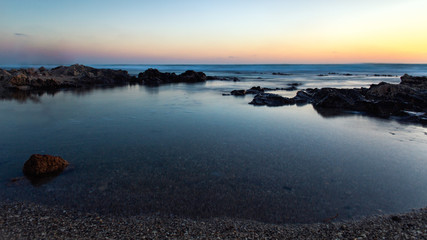 Sea landscape with sand, sky and clouds background. D