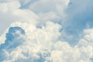 Naklejka na ściany i meble Beautiful white fluffy cloud abstract background. Cloudscape. Fluffy white clouds on sunny day. Nature weather. Soft like cotton texture of cloud. Puffy clouds. Wish and peaceful concept. Sunshine.