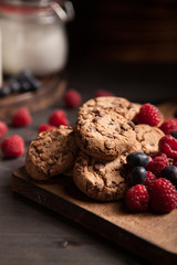 Delicious chocolate cookies for breakfast with milk and blueberries