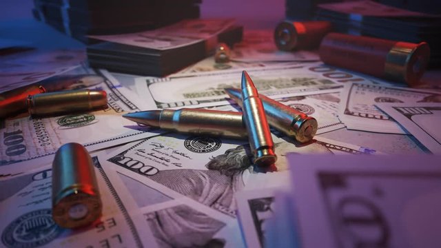 Ammo bullets in the middle of mafia table stacked with cash. Neon lights. 4KHD