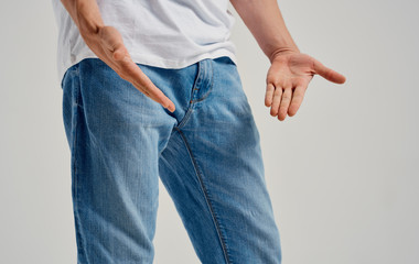 man in jeans with hands on hips