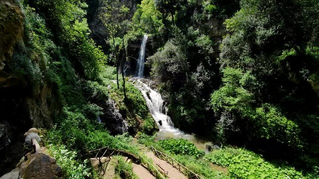 Magnificent waterfall in Sunny weather in Tivoli wildlife Park, Italy.