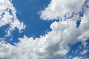 Sky with cumulus clouds. The background is blue and white. sunny day.