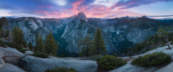 Half Dome and Yosemite Valley in Yosemite National Park during colorful sunrise with trees and rocks. California, USA Sunny day in the most popular viewpoint in Yosemite Beautiful landscape background