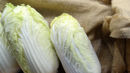 Fresh napa cabbages in basket, a type of Chinese cabbage, leaves are the harvested organ, lay side...