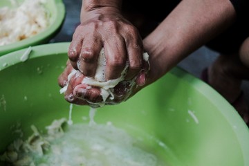 hands cutting meat
