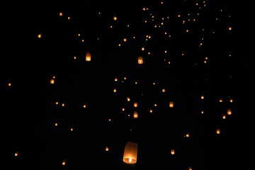 Loi Krathong and Yi Peng released paper lanterns on the sky during night
