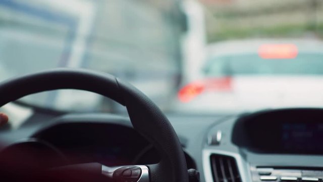 Closeup Of Man's Hands beats hits the Steering Wheel