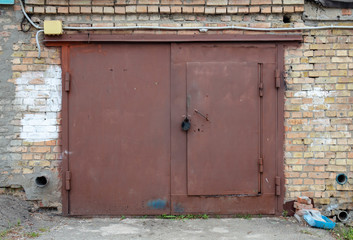 old metal door to the car garage