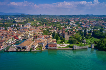 Fototapeta na wymiar Panoramic view of the city center of Lazise on Lake Garda, Italy. Aerial photography with drone.