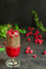 raspberry and chia seed pudding cocktail dessert (sweet drink, dessert snack). top food background. copy space