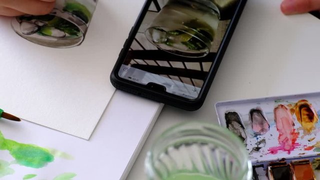 View of the workspace of a painter, Close up moving right to left