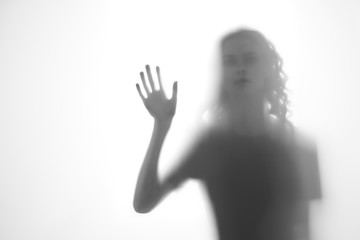 silhouette of hand on black background