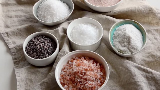 Different salt  types on grey background. 