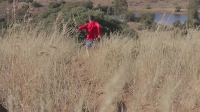 Trail runner running fast going down a hill