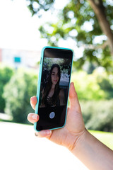 Girl taking selfie with smartphone