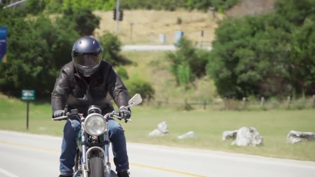 Motorcyclist Riding With Leather Jacket