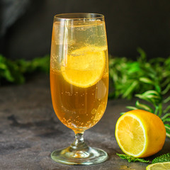 lemonade with lemon and ice (cooling drink). top food background. copy space