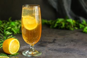 lemonade with lemon and ice (cooling drink). top food background. copy space
