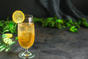 lemonade with lemon and ice (cooling drink). top food background. copy space