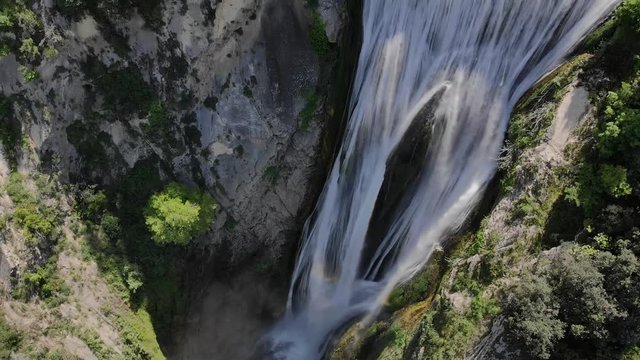 Aerial flight over the Waterfall that is in Tivoli Italy. Waterfall in the national Park in Sunny weather