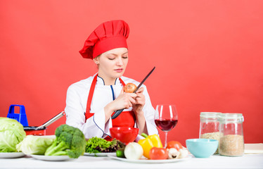 restaurant menu. Dieting. happy woman cooking healthy food by recipe. professional chef on red background. organic eating and vegetarian. Housewife. woman in cook hat. Chef cooking vegetarian recipe