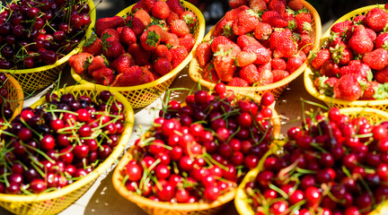 red strawberry in basket. vitamin and dieting. seasonal fruit. natural shopping. organic useful food. healthy lifestyle. farm market. summer berry market. ripe cherries cherry. Fresh organic fruit