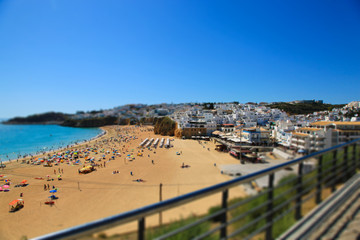 Obraz premium View on the beach Praia do Tunel and Albufeira in Algarve, Portugal.Tilt shift effect.