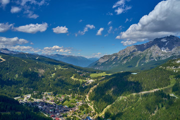 Fototapeta na wymiar Aerial photography with drone. Great view of the Madonna di Campiglio Italy ski resort summer time.